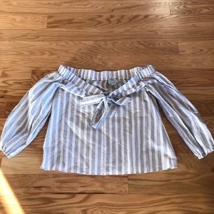 Off the shoulder, short waisted blouse.